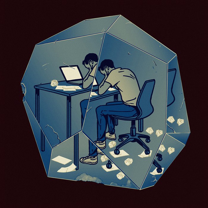 Image of a person working at a desk with their face in their hands, inside of a crystal.